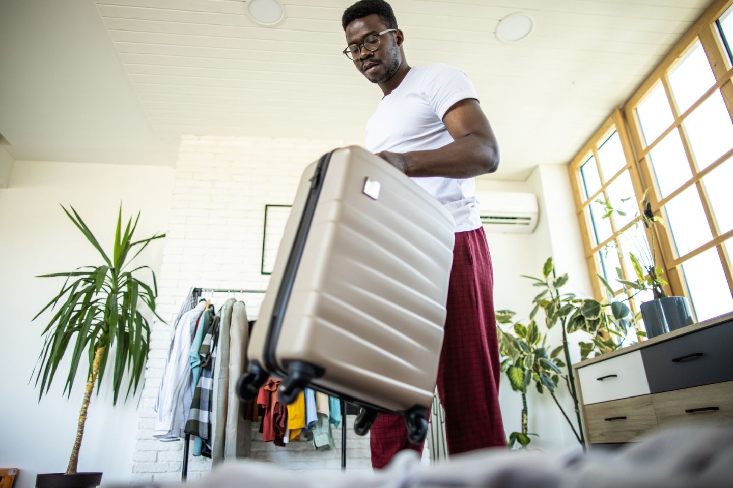 man holding suitcase