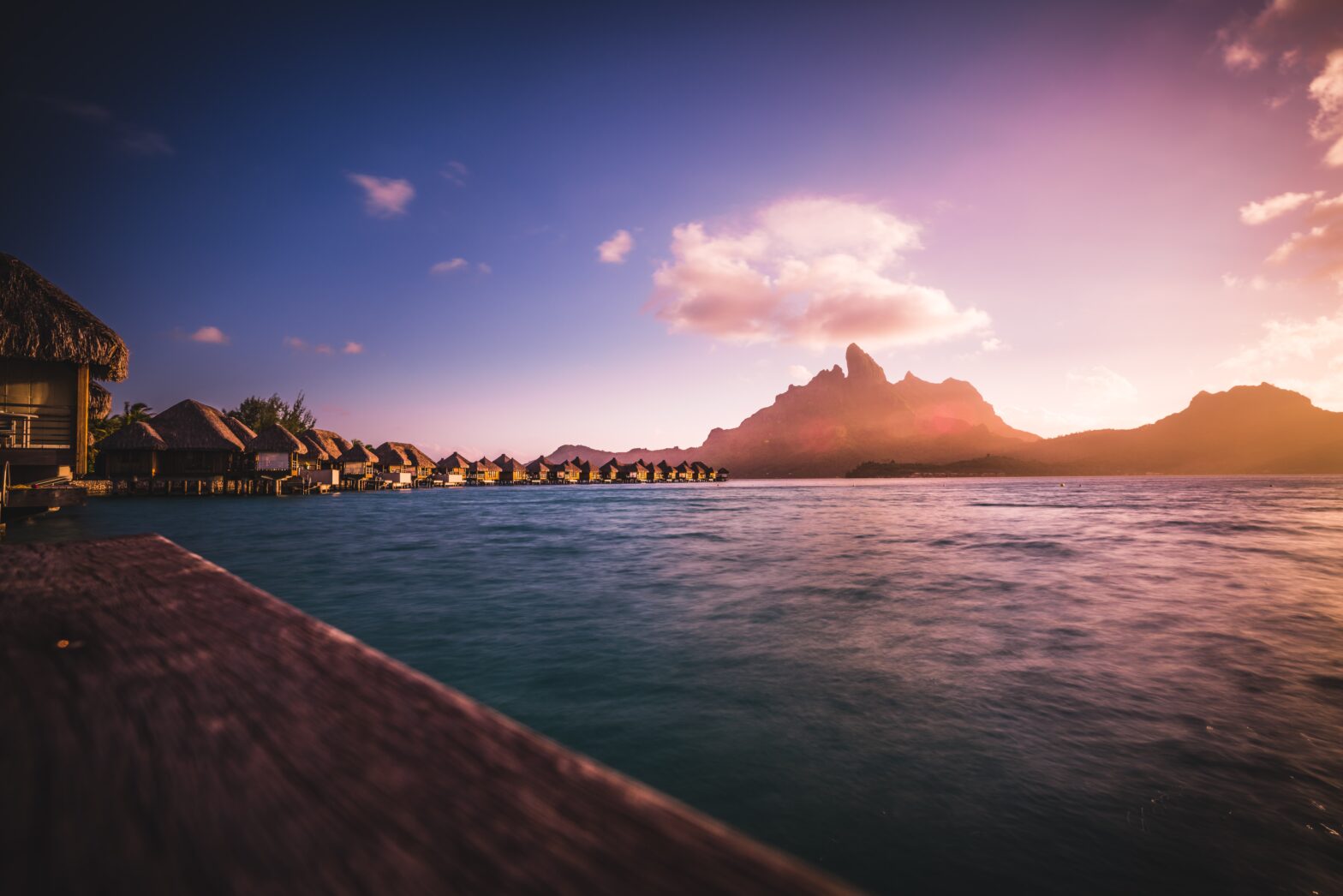 Due to the gorgeous setting of the film "Couples Retreat" many viewers wonder where was "Couples Retreat" filmed. pictured: Bora Bora at sunset overlooking the water and mountain view