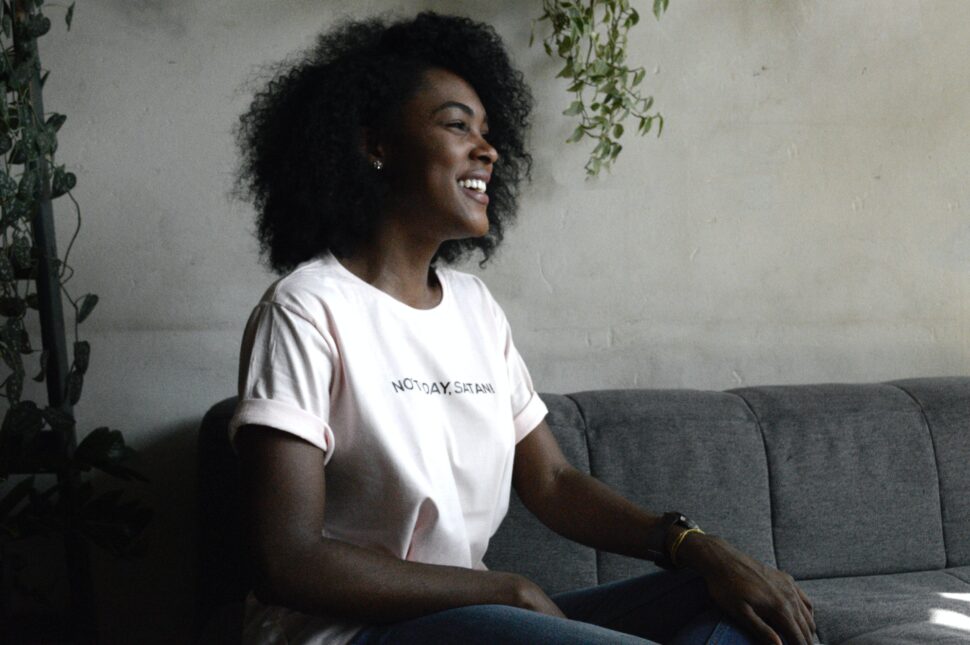 Woman with Afro smiling