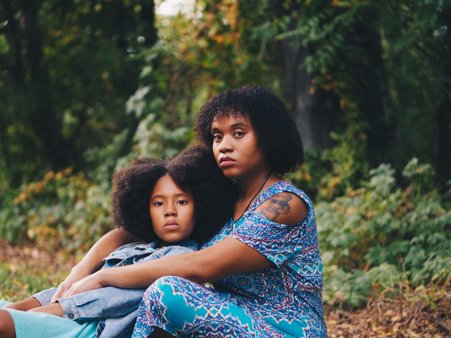 mother and daughter posing together