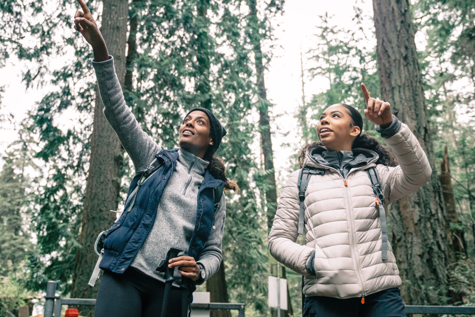 Wide open spaces are a joy to experience. Pictured: two hikers out in nature enjoying the scenery.