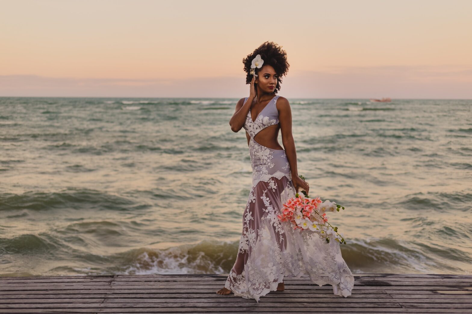 woman in bridal gown on the beach