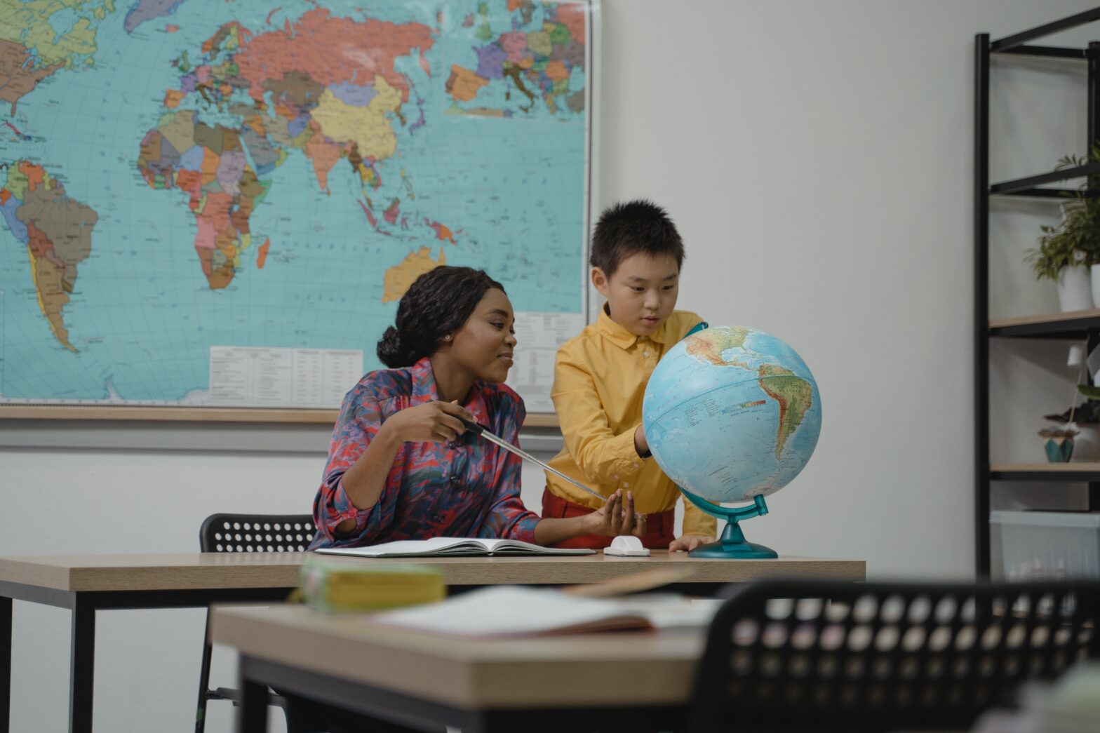 female teacher with student - teaching abroad