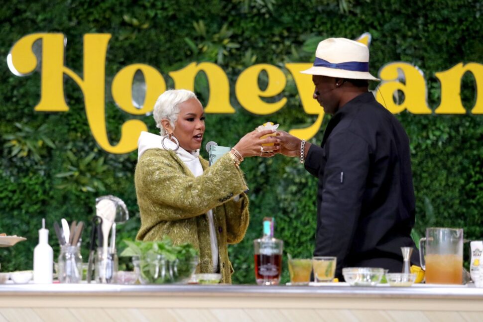 two people toasting cocktails