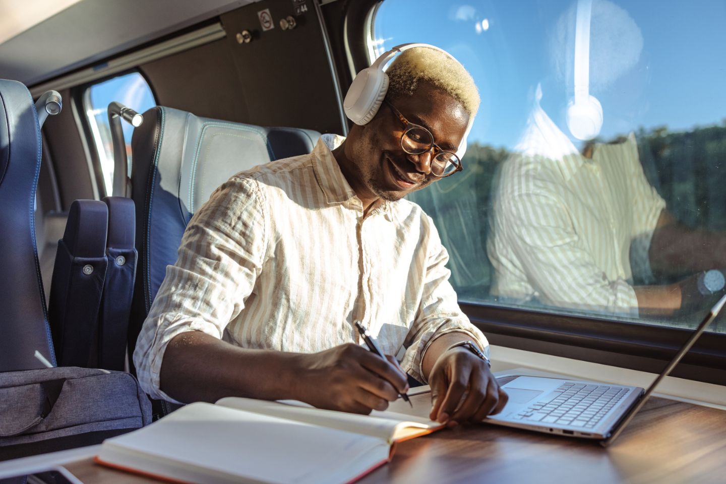 man doing work on a train