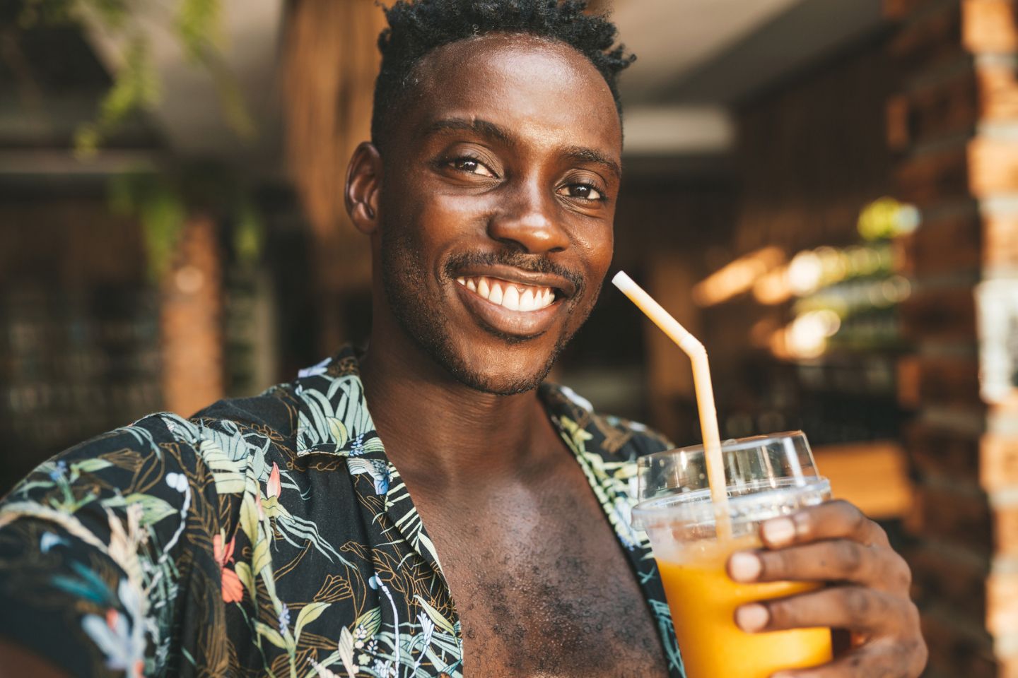 man smiling with juice