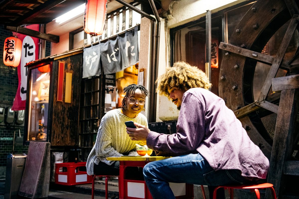 two travelers at night in Japan