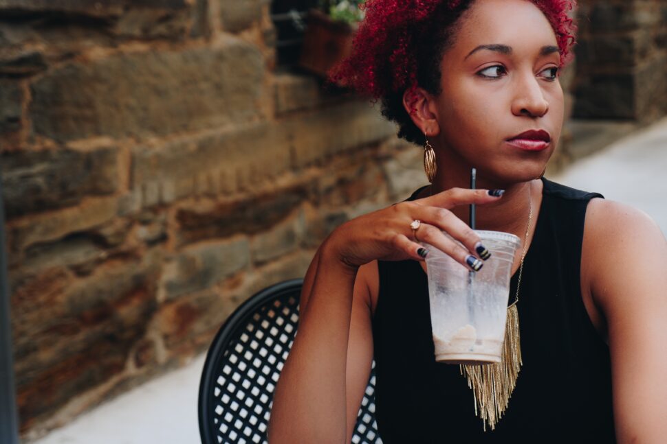 woman sipping a drink