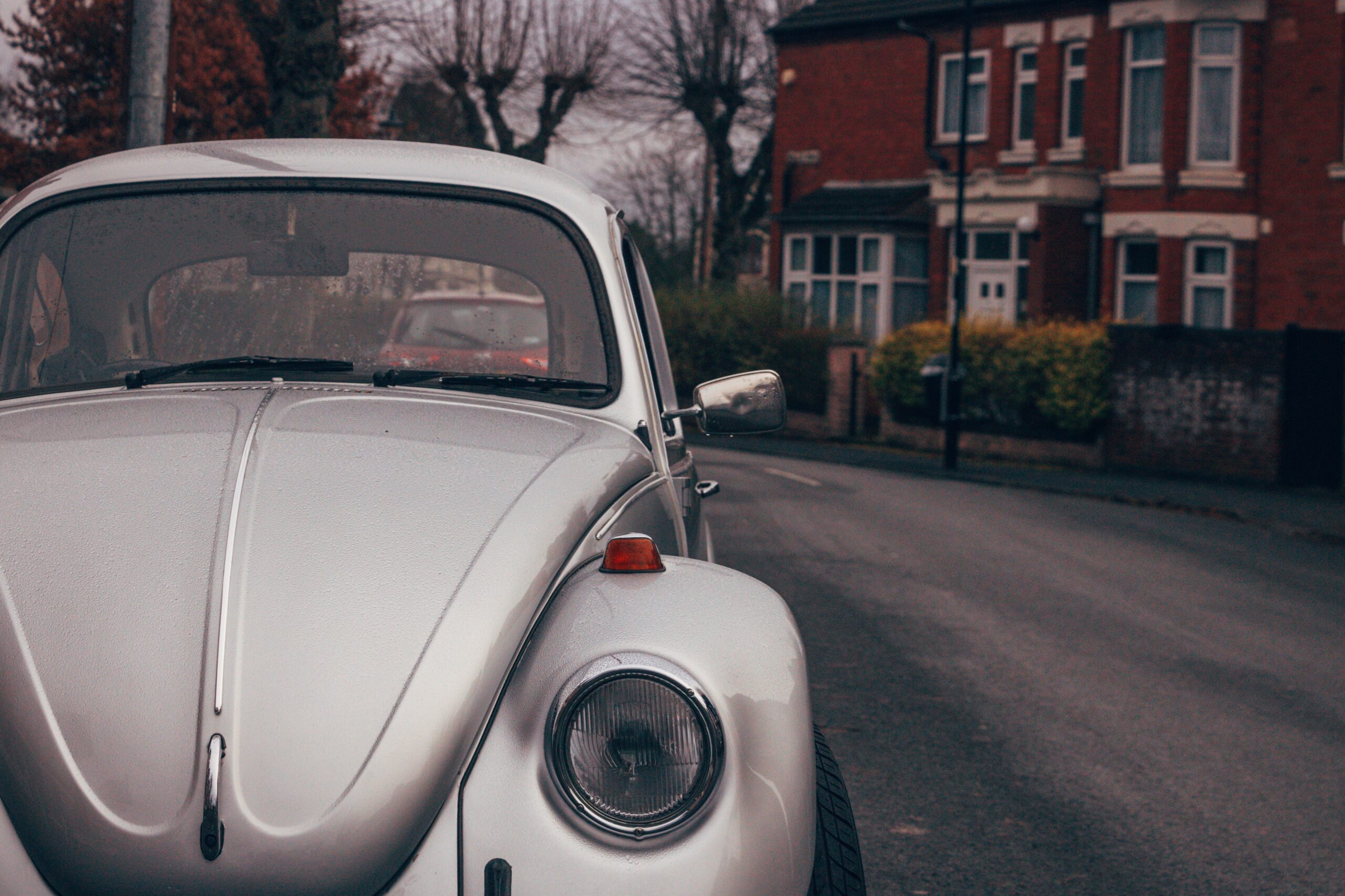 This game is a fun and popular activity for extended time in the car. 
pictured: A  silver Volkswagen Beetle on the side of the road