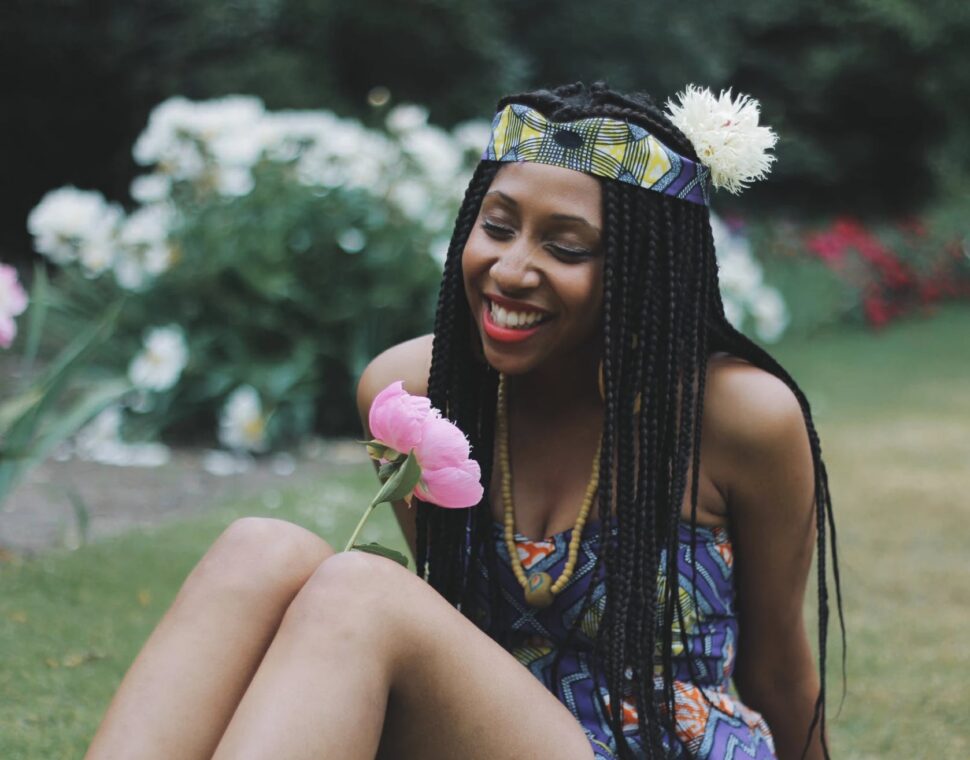 woman smiling with flowers