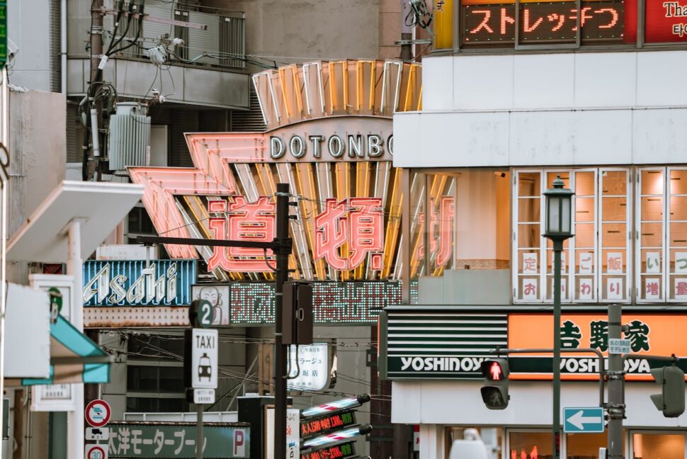 A close up shot of neon signs on buildings in the Dotonbori district.