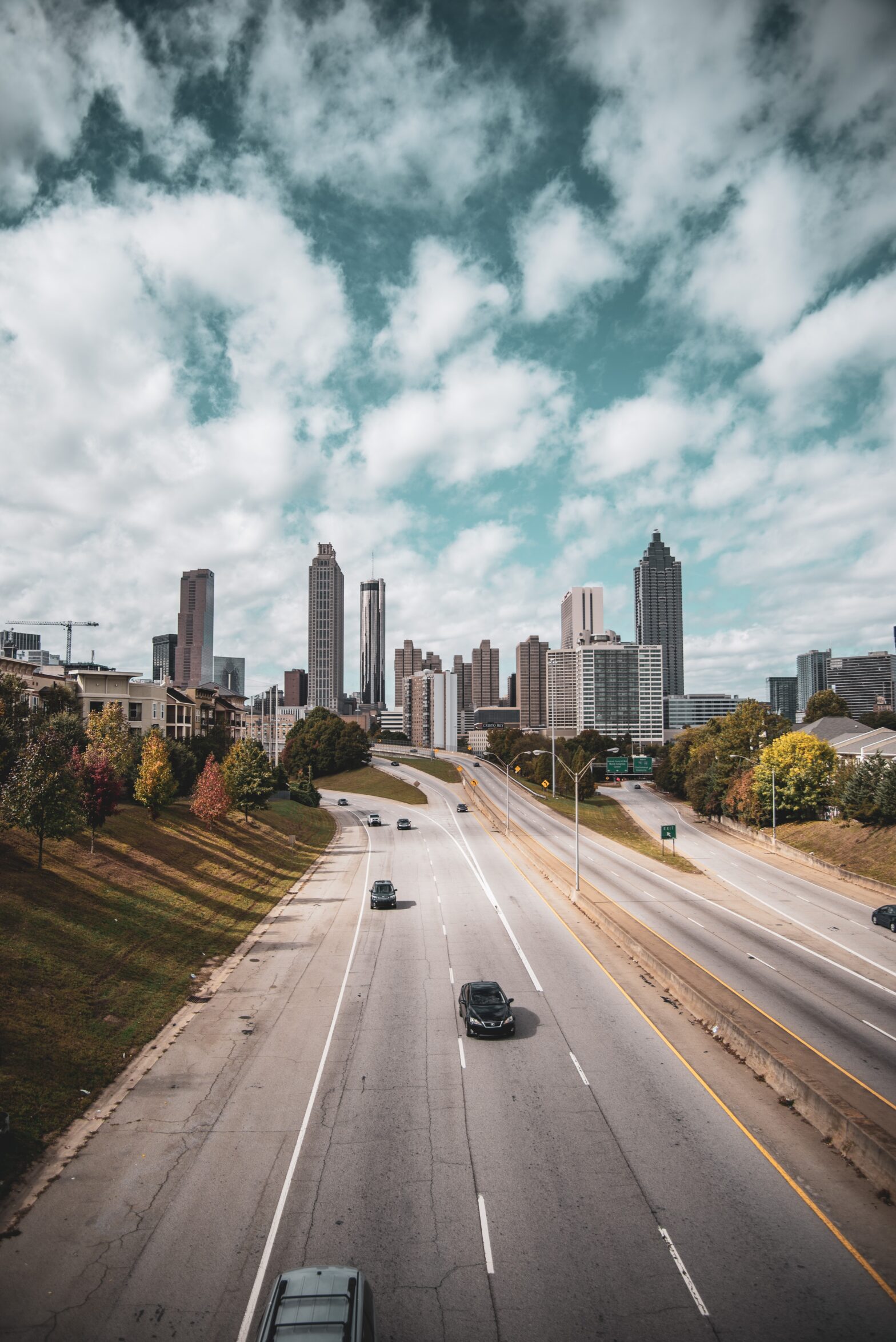 cars driving on highway toward downtown skyline in Atlanta, Georgia