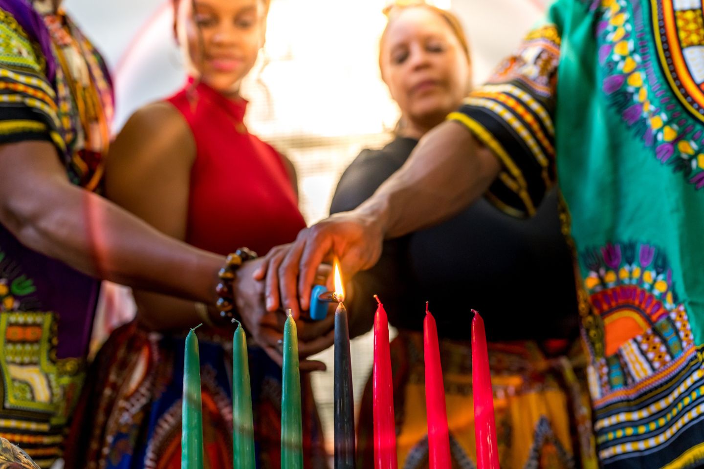 Family lighting candles during Kwanzaa