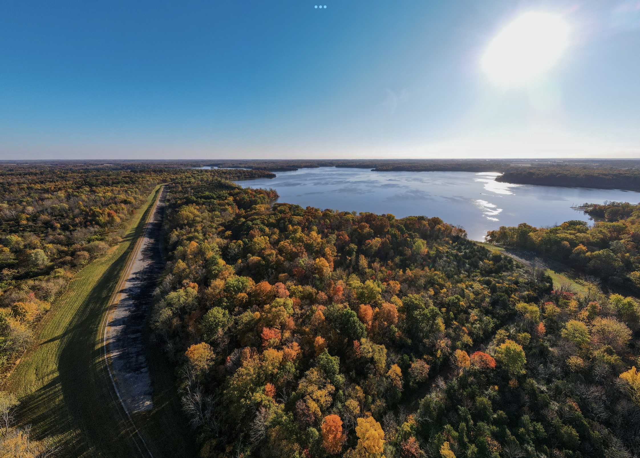 Columbiana, Ohio is an underrated location that has unique Christmas celebrations.
Pictured: Ohio’s thriving forest and lake on a bright sunny day