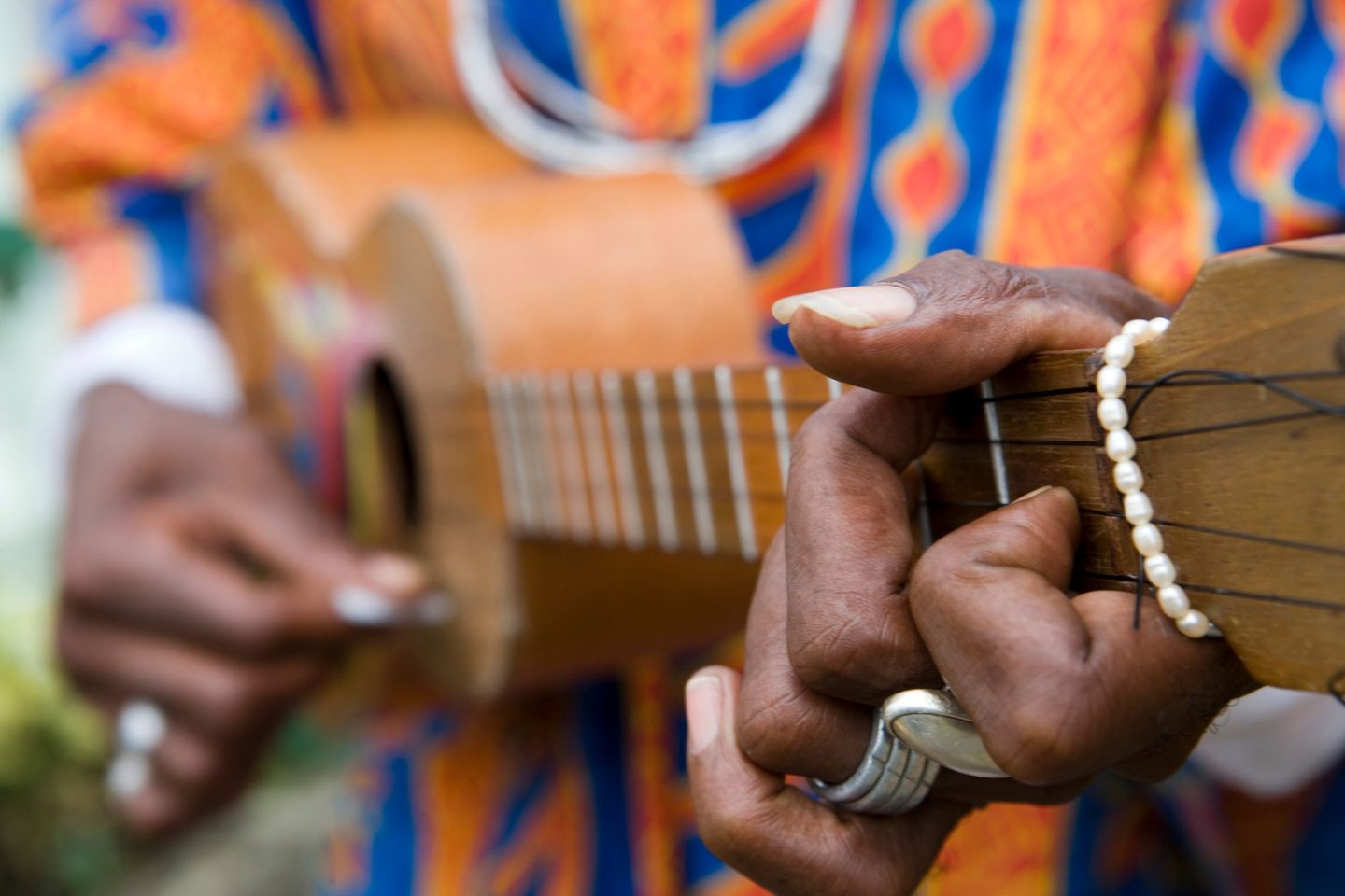 man strumming guitar in Grenada