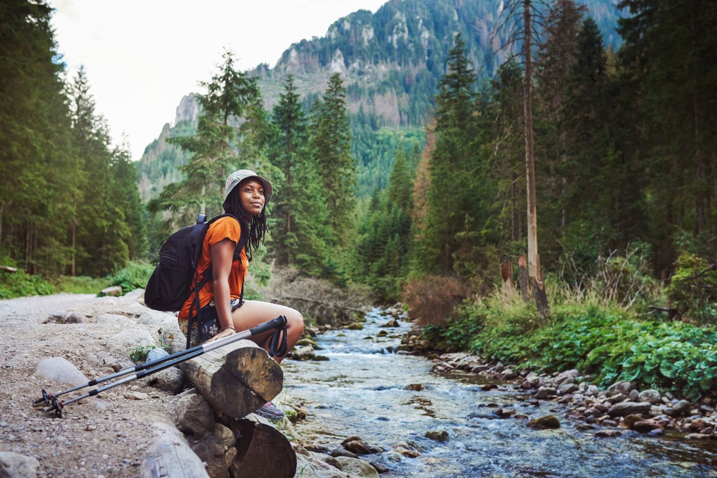 person standing by river in nature