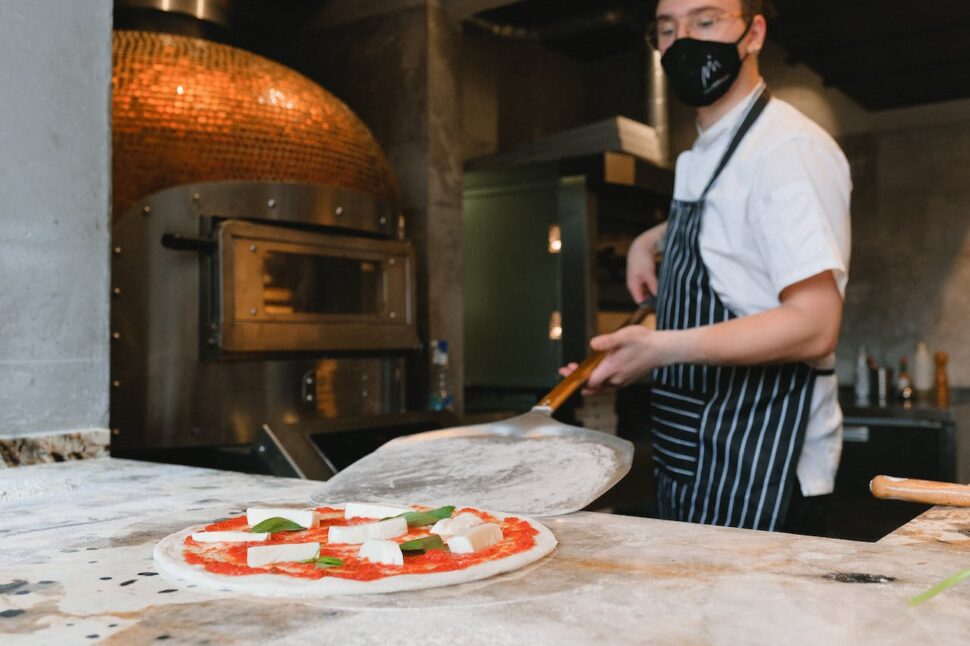 Man preparing a pizza