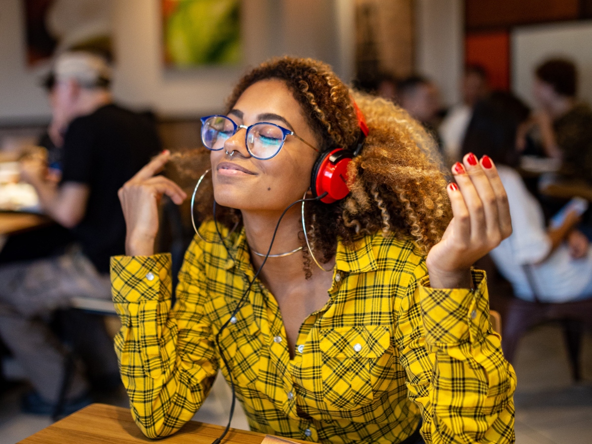 woman with headphones on listening to music