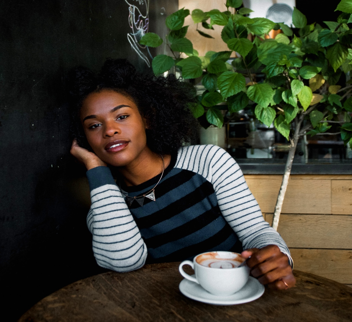 Black woman in a coffee shop