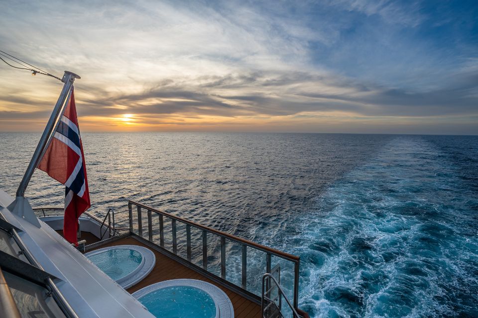 HX Hurtigruten Expeditions - MS Spitsbergen jacuzzis overlooking the sea at sunset