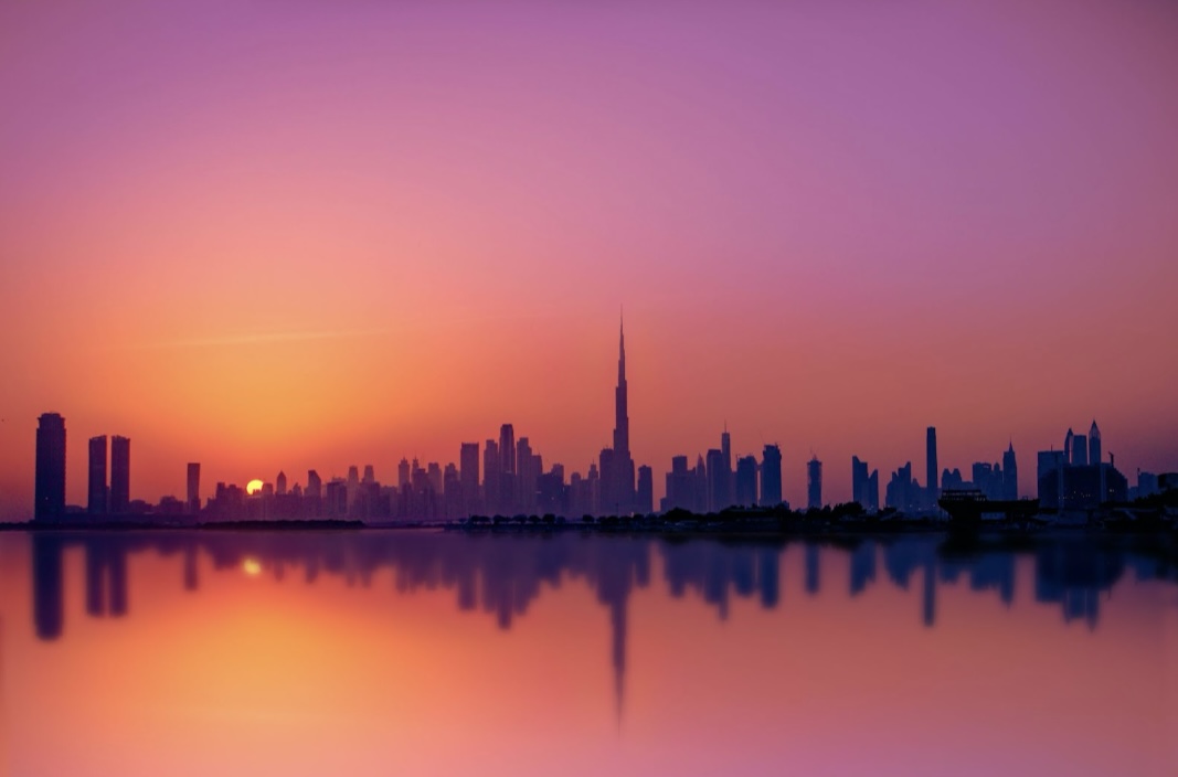 These techniques and tips will help tourists wanting to travel and navigate through Dubai. 
Pictured: overlook of water and a orange Dubai sunset 