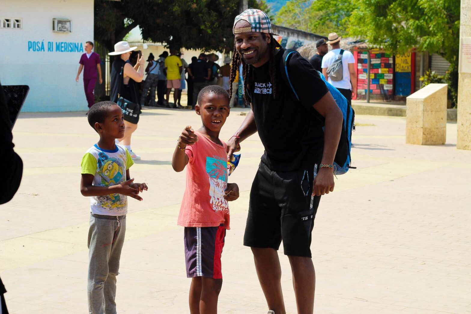 Jarvis Houston, a Black expat in Colombia, with children during travels