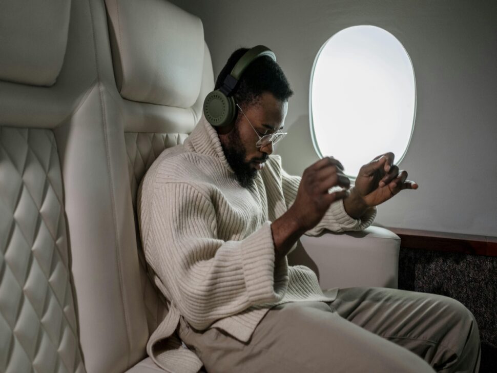 Man Listening to Music While Inside an Airplane