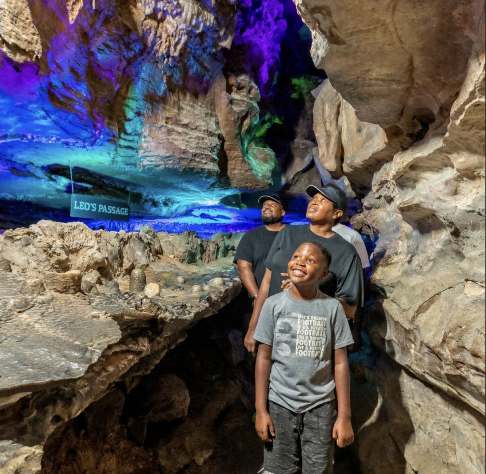 Family walking through the caves leading to Ruby Falls in Chattanooga.