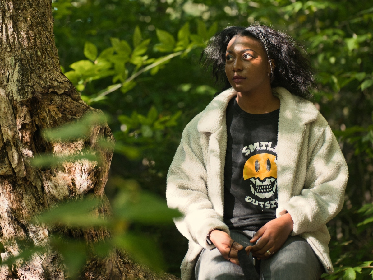 Black woman outdoors on a walking trail