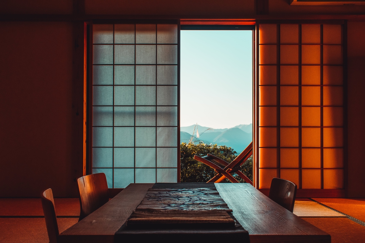 View out the window of a traditional Japanese room during golden hour