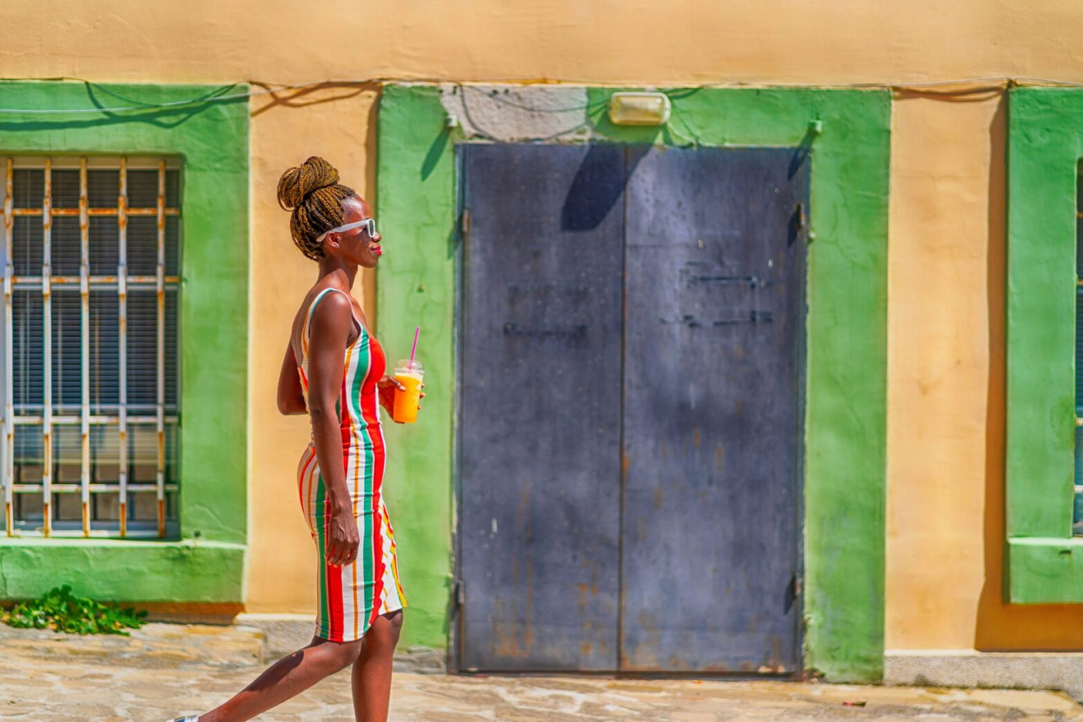 woman walking with a juice