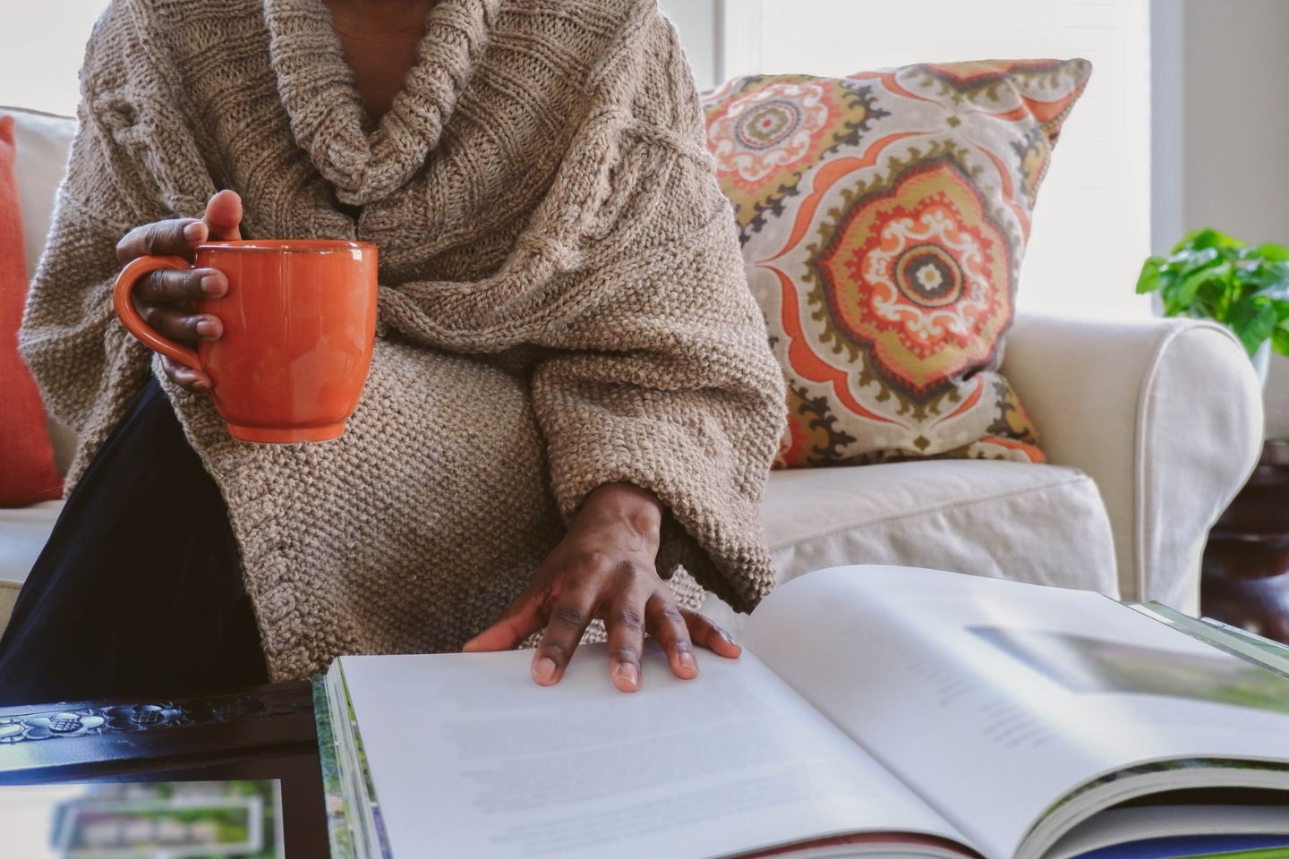 woman reading a coffee table book