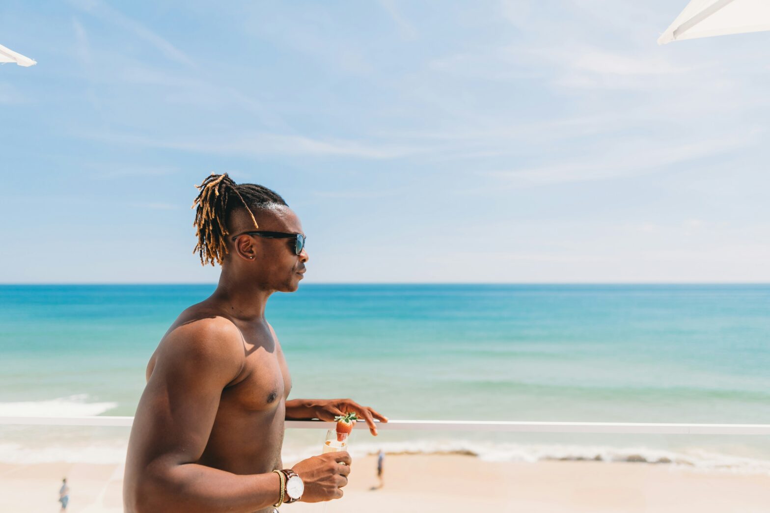 Black man solo traveling on the Beach.