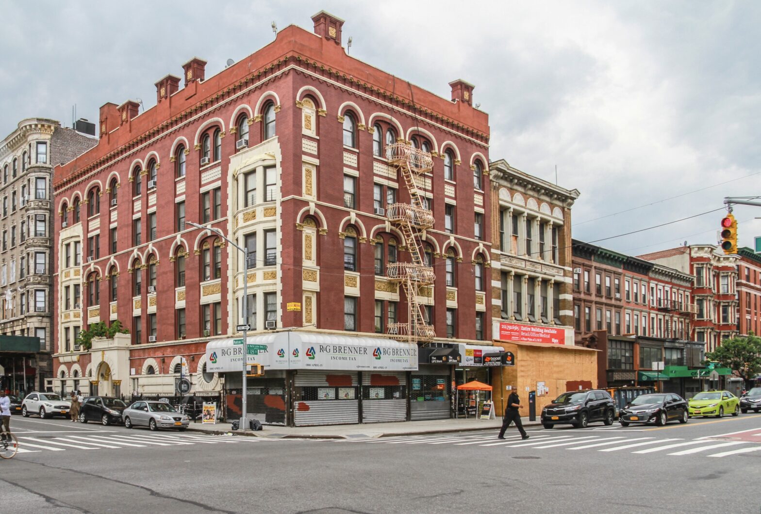 Harlem's current safety level is often confused with the district's past. Learn more about why Harlem is how it is today. pictured: a bustling street of Harlem on a cloudy day