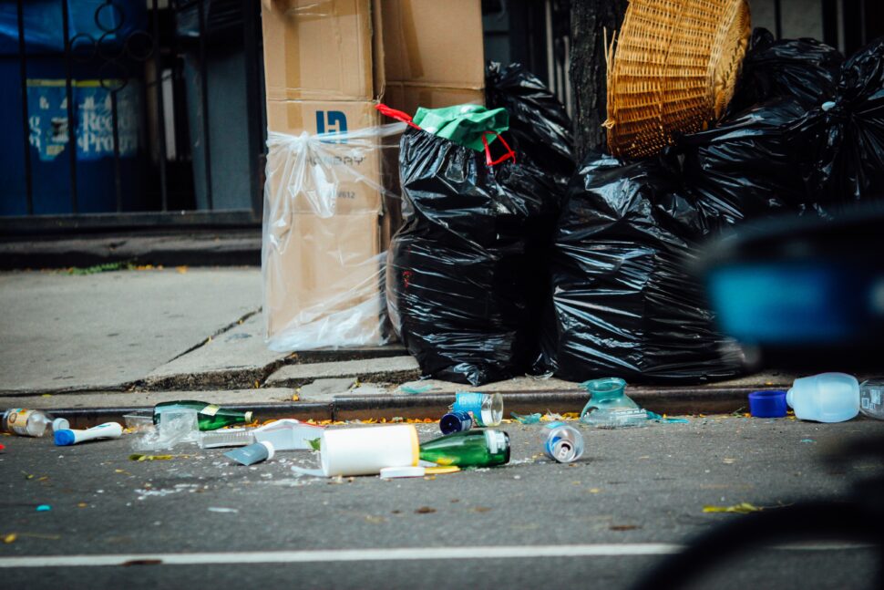 trash thrown on the ground in the city