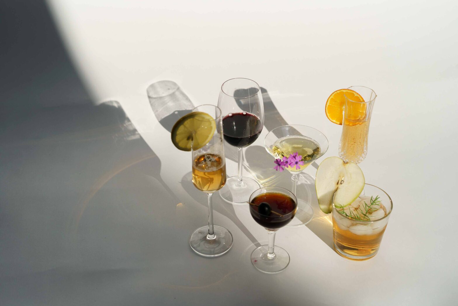 a few cocktails on a white table