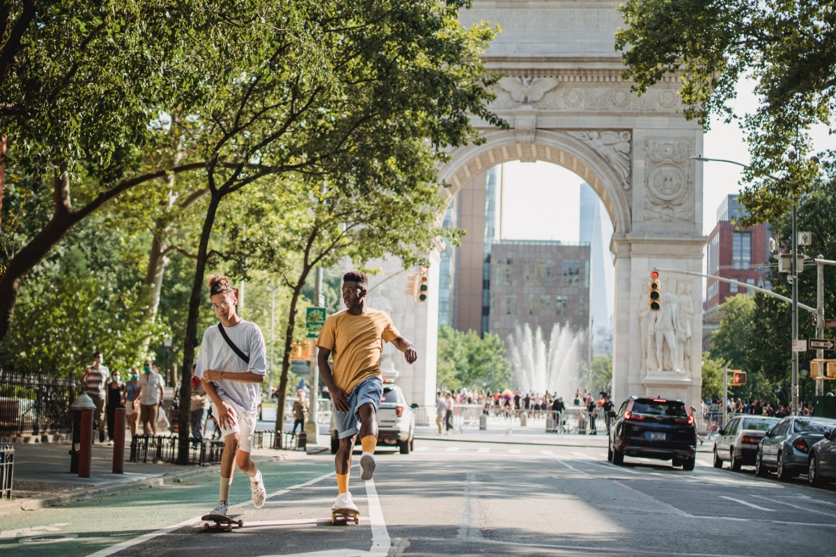 teens wearing comfortable travel shoes and skateboarding