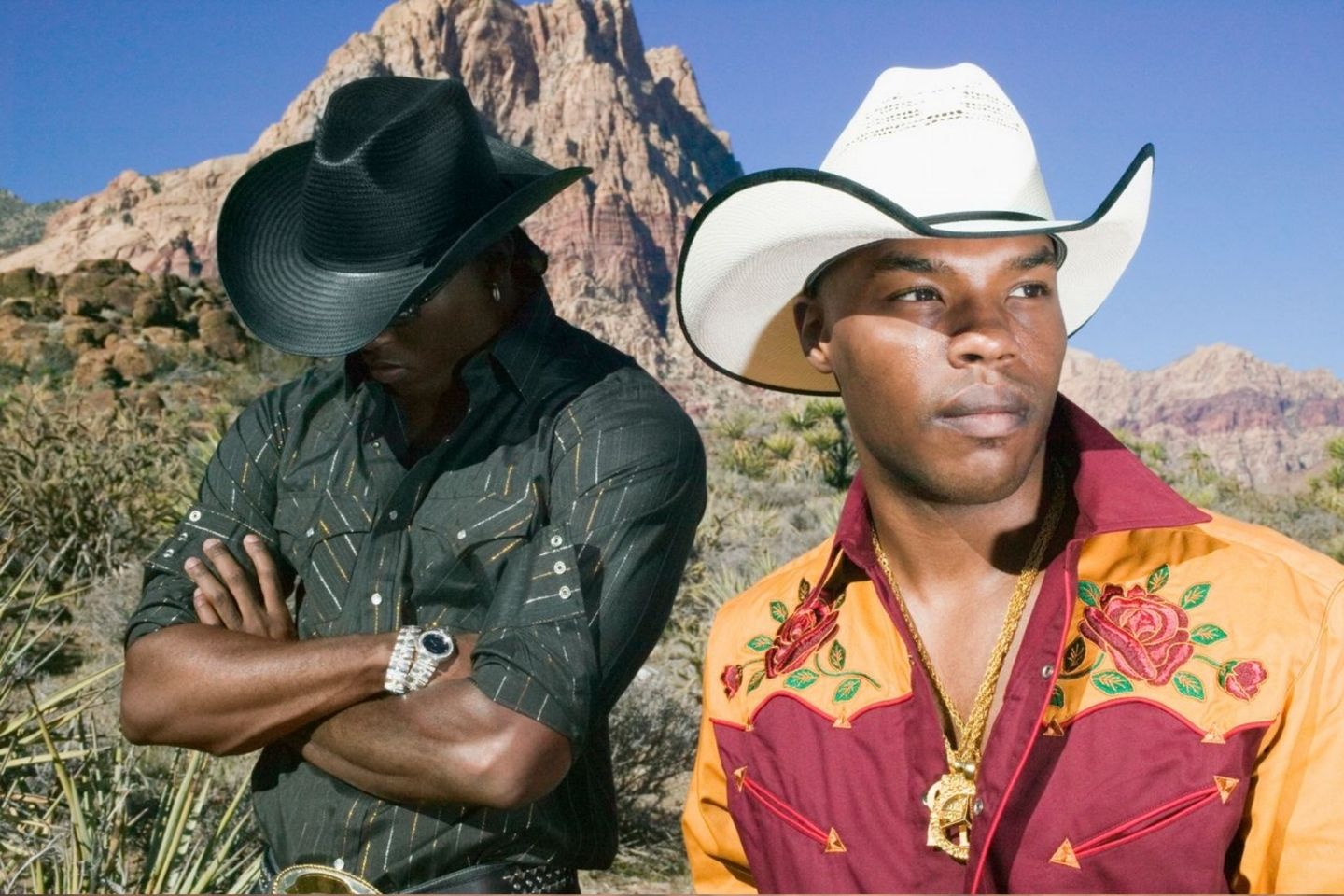 two young men wearing cowboy attire