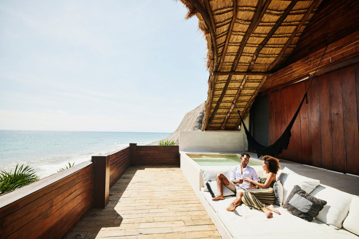 Couple Relaxing on rooftop of a Luxury Villa