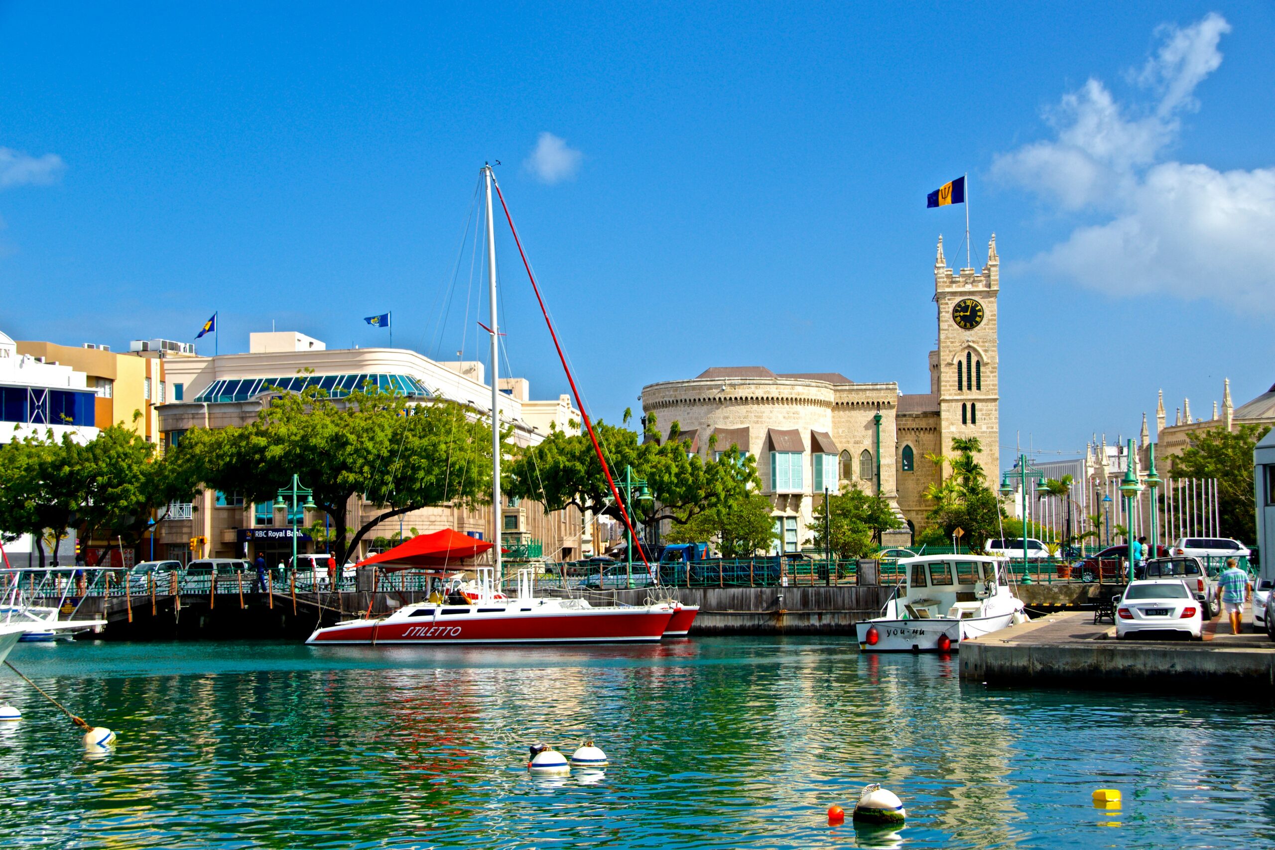 Barbados is a relatively safe destination to travel to. learn more about how safe the country is. 
pictured: a dock of central Barbados on a bright blue day