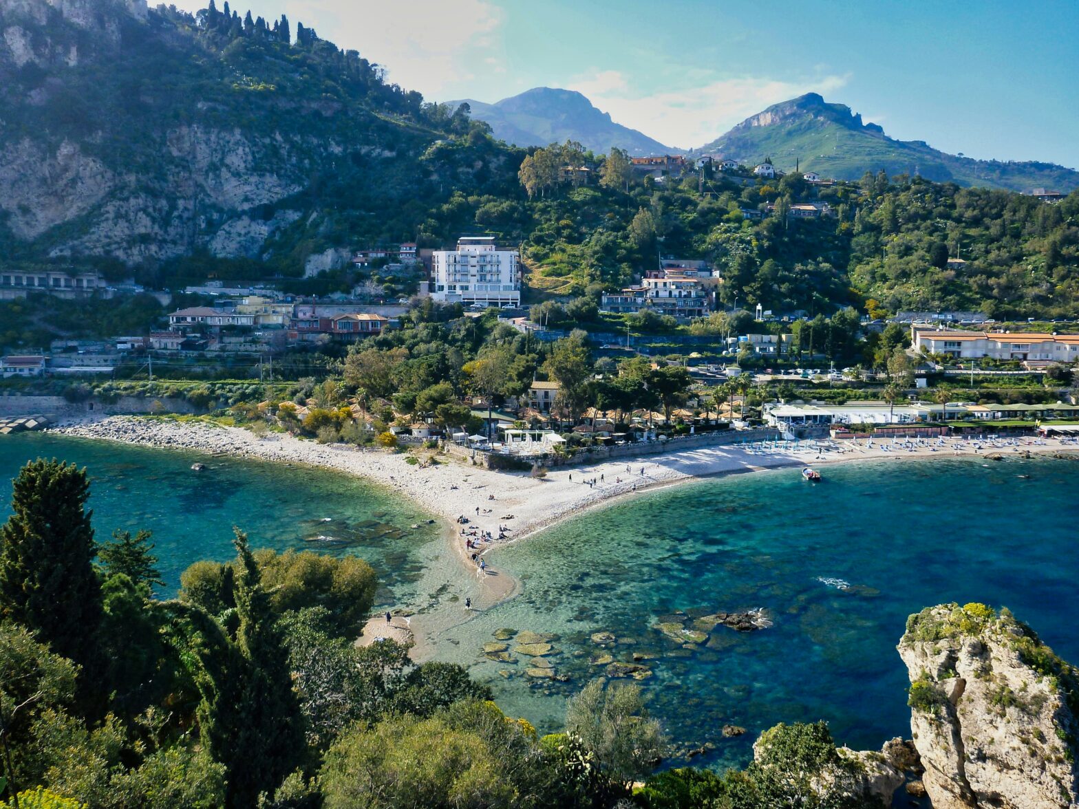 Taormina is a traveler's dream destination. Learn more about its tourism offerings and why travelers should visit. pictured: the vibrant lands and seas of Taormina, Italy