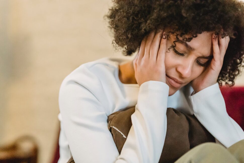 woman worried with hands on face