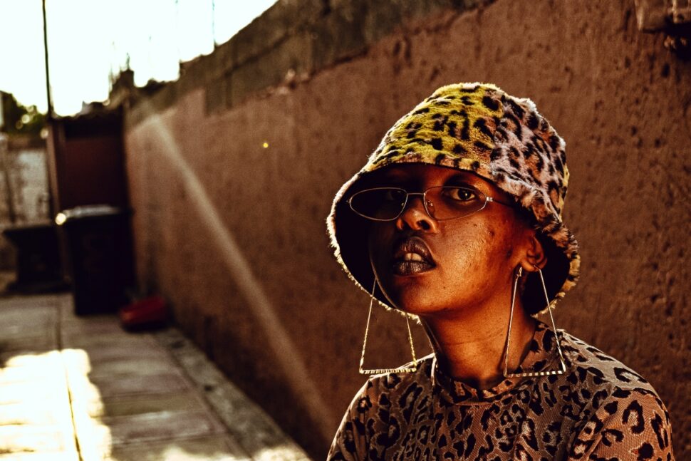 
woman in brown and black leopard print shirt wearing sunglasses