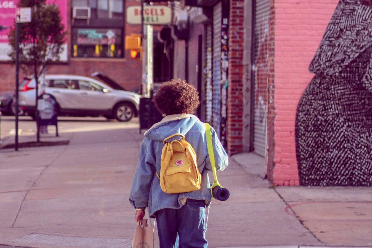 person walking along street in Brooklyn, New York