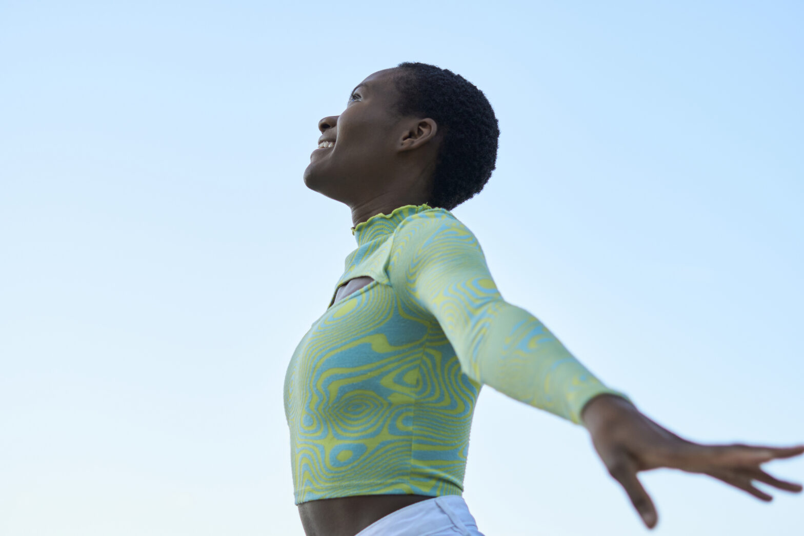 happy Black Woman smiling and looking to the sky