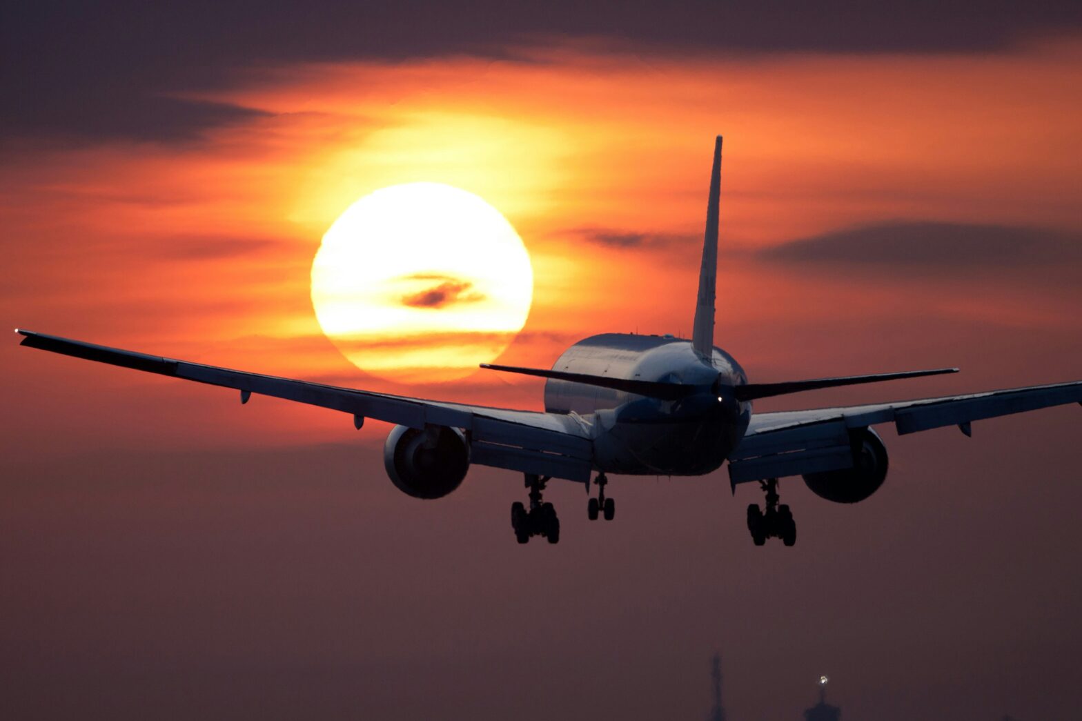 Learn all there is to know about Boeing 777 aircrafts and recent safety issues. Pictured: an airplane flying off into the sunset