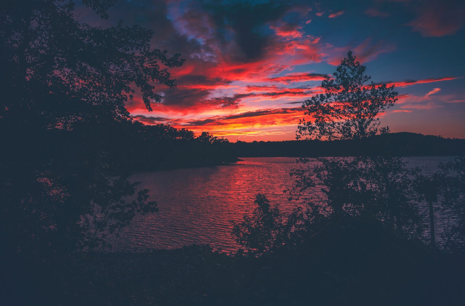 Check out everything travelers should know about Lake Lanier and its safety. Pictured: Lake Lanier during a red sunset