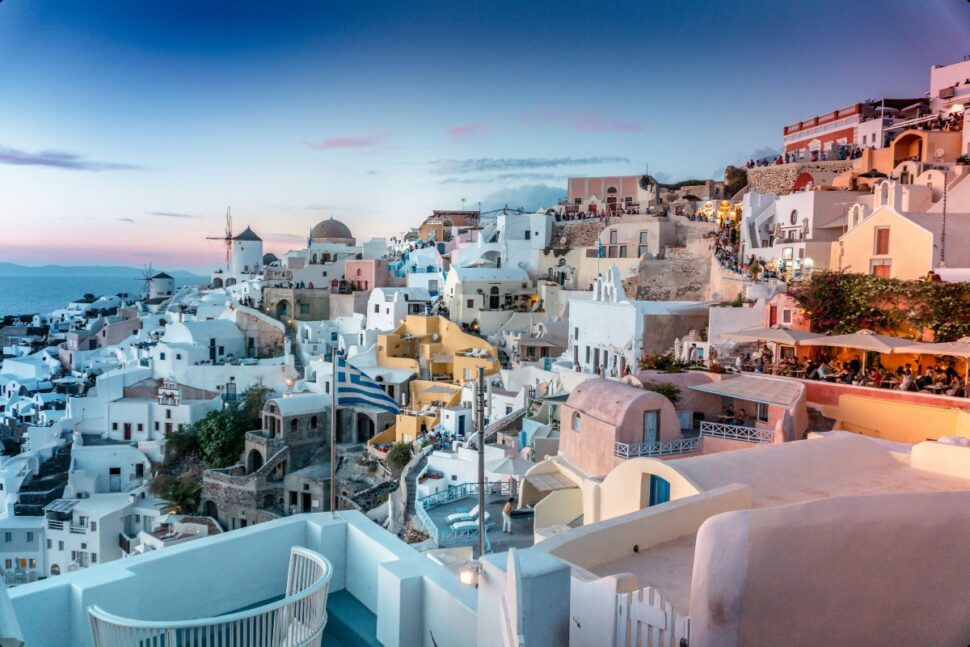 white buildings on cliffside in Santorini, Greece