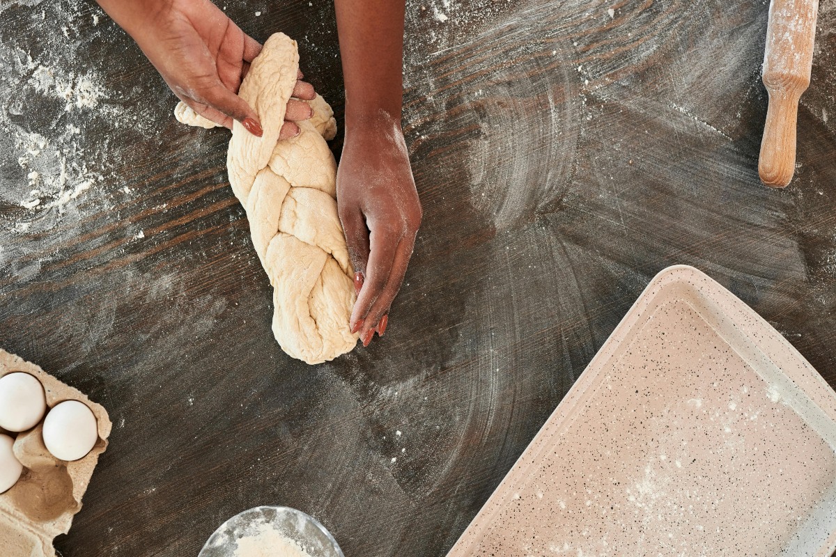 woman making break on a counter