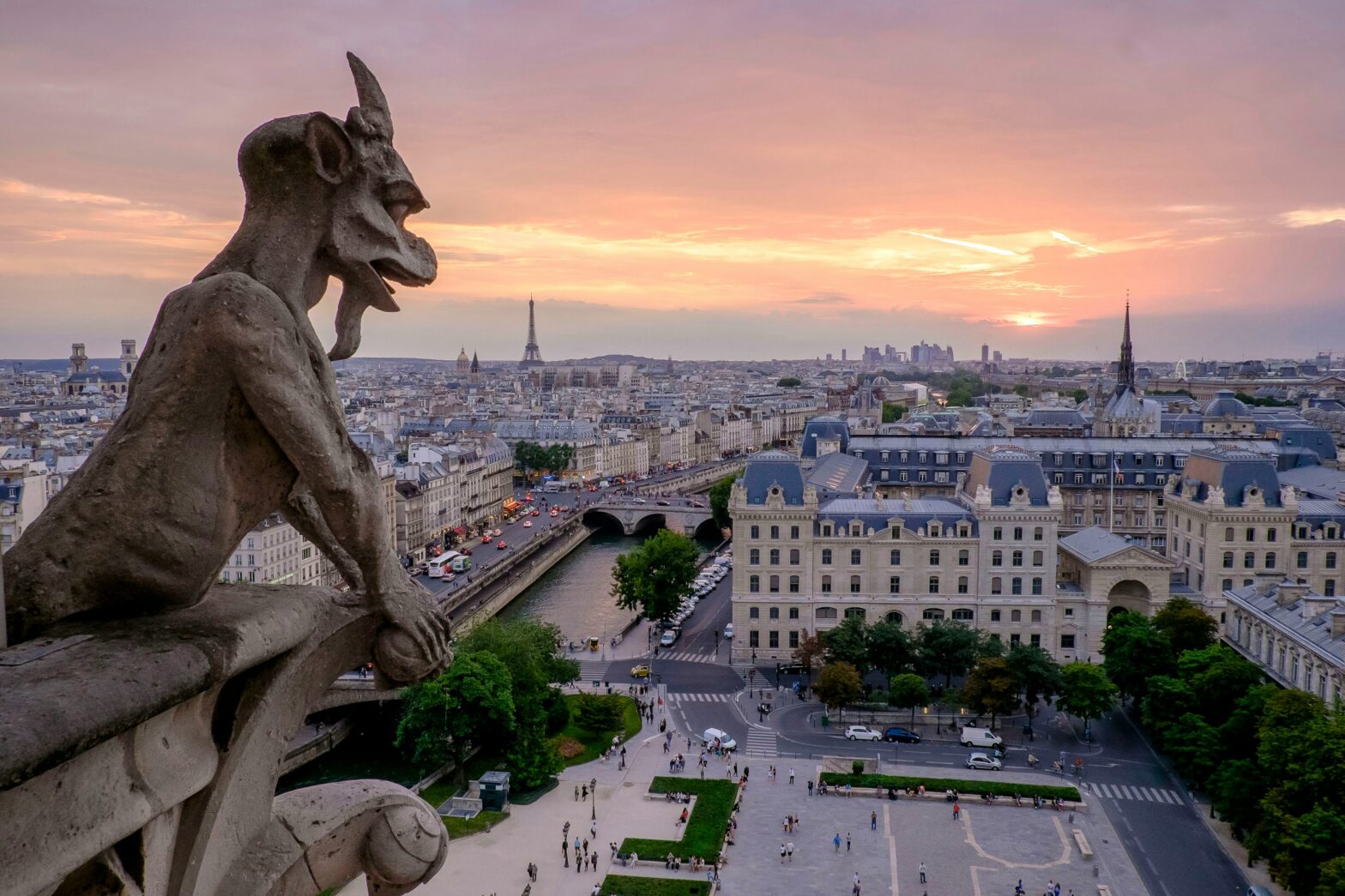 overhead view of the Eiffel Tower and the gargoyle at Notre Dame Cathedral in Paris, France